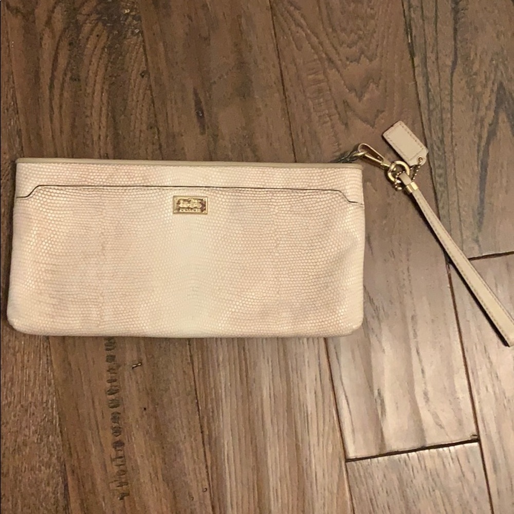 Coach embossed cream wristlet/clutch